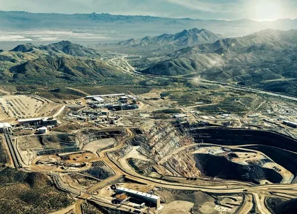 Aerial view of an open-pit mine with haul roads and processing facilities