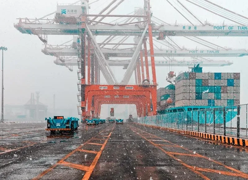 Container terminal roadway with gantry cranes and stacked shipping containers