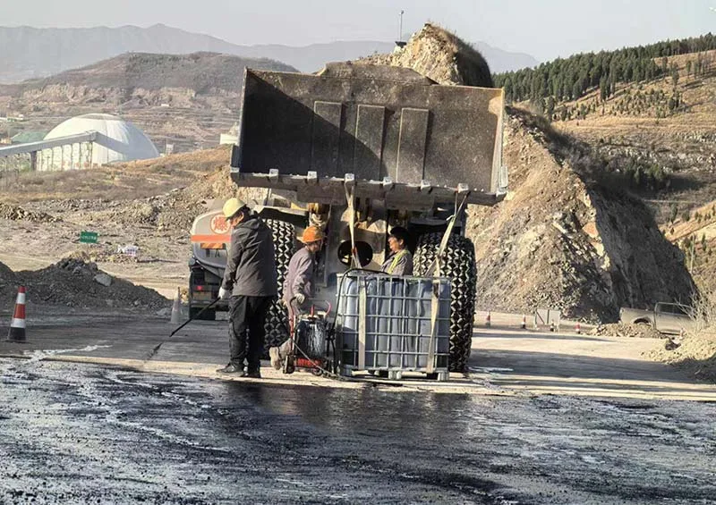 Aerial view of an open-pit mine with haul roads and processing facilities
